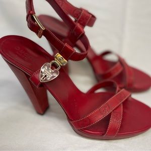 Gucci heart locket strappy sandal.